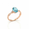 Oval-Cut Blue Topaz Ring in 14K Rose Gold with Pavé Diamond Twisted Shank
