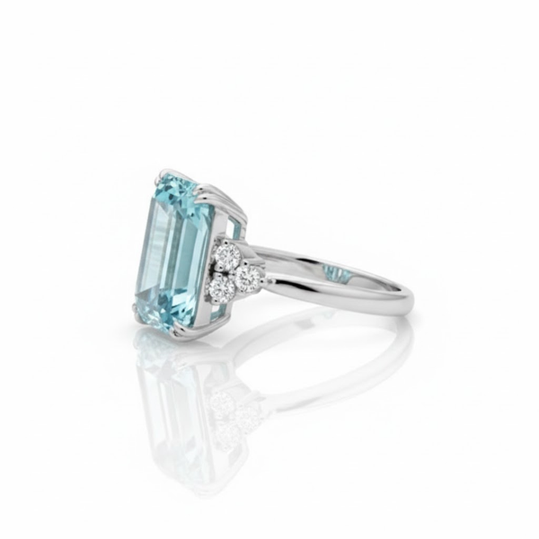 Three-Stone Emerald-Cut Blue Topaz Ring with Brilliant Diamond Side Clusters