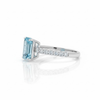 Emerald-Cut Blue Topaz Solitaire Ring in 14K White Gold with Pavé Diamond Band