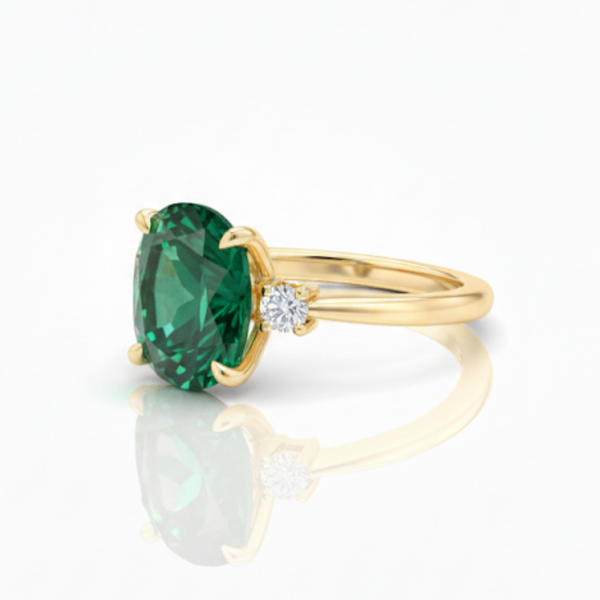Oval Cut Emerald and Lab Grown Diamond Three-Stone Ring