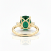 Oval Cut Emerald and Lab Grown Diamond Three-Stone Ring