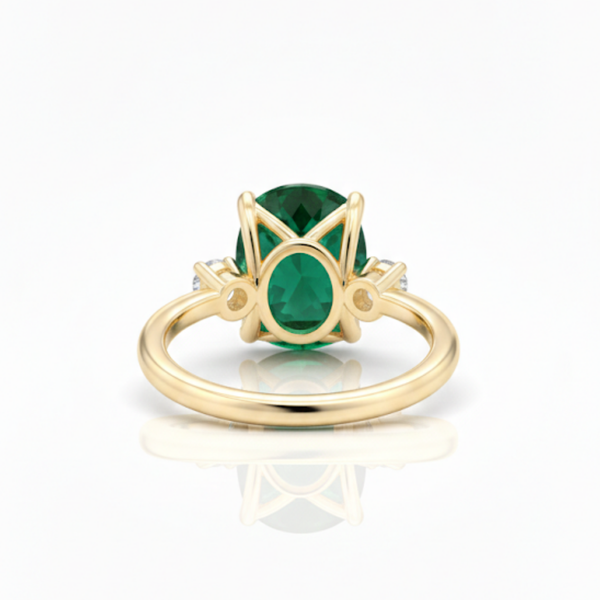 Oval Cut Emerald and Lab Grown Diamond Three-Stone Ring