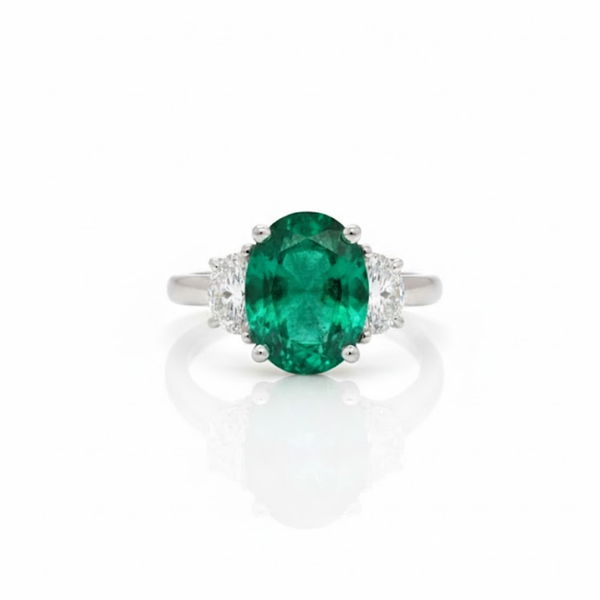 Oval Cut Emerald and Lab Grown Diamond Three-Stone Ring