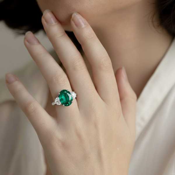 Oval Cut Emerald and Lab Grown Diamond Three-Stone Ring