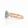 Oval-Cut Blue Topaz Ring in 14K Rose Gold with Pavé Diamond Twisted Shank