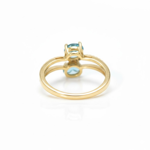 Two-Stone Oval Blue Topaz Bypass Ring in 14K Yellow Gold with Pavé Diamonds