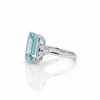 Three-Stone Emerald-Cut Blue Topaz Ring with Brilliant Diamond Side Clusters