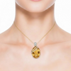 Large Oval-Cut Citrine Pendant in 14K Yellow Gold with Diamond Bypass Detail