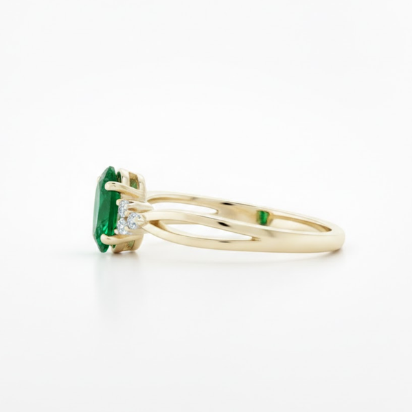 Oval Emerald and Trio Lab Grown Diamond Split-Shank Solitaire