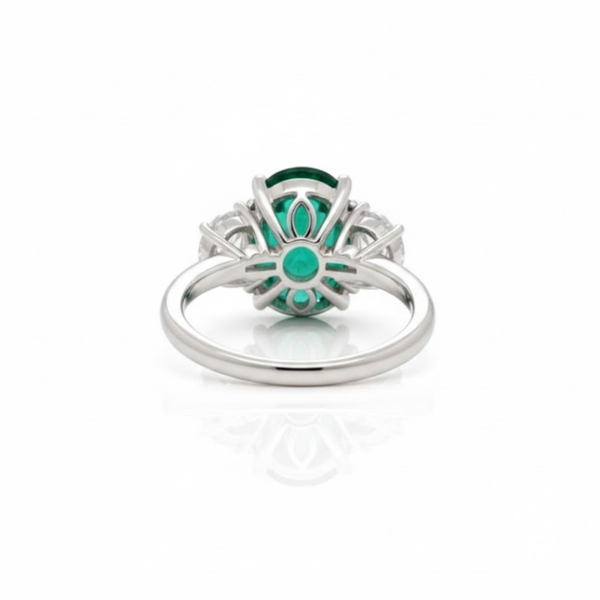 Oval Cut Emerald and Lab Grown Diamond Three-Stone Ring