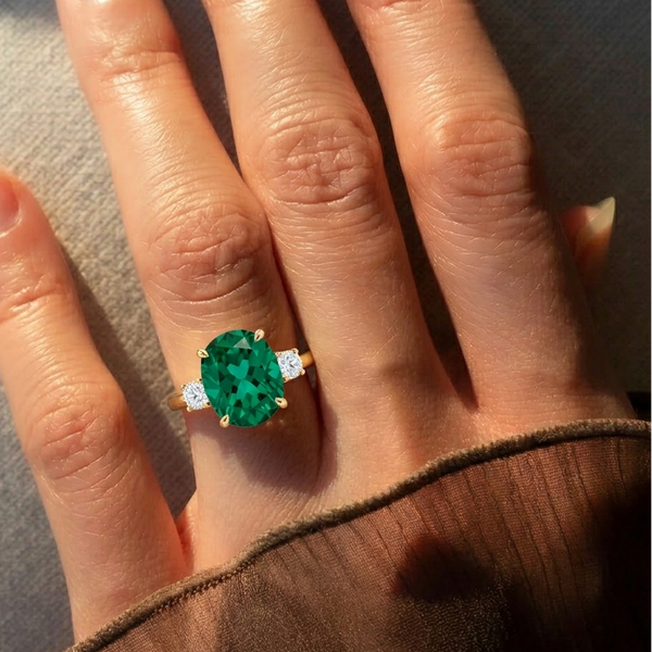 Oval Cut Emerald and Lab Grown Diamond Three-Stone Ring
