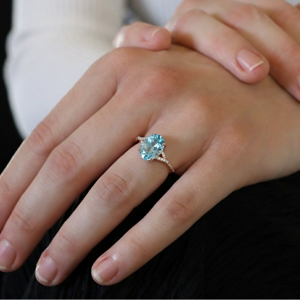 Oval-Cut Blue Topaz Ring in 14K Rose Gold with Pavé Diamond Twisted Shank